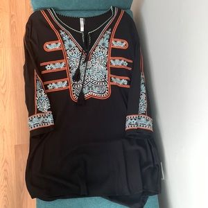 Tunic top with tassel strings.  Like new size L